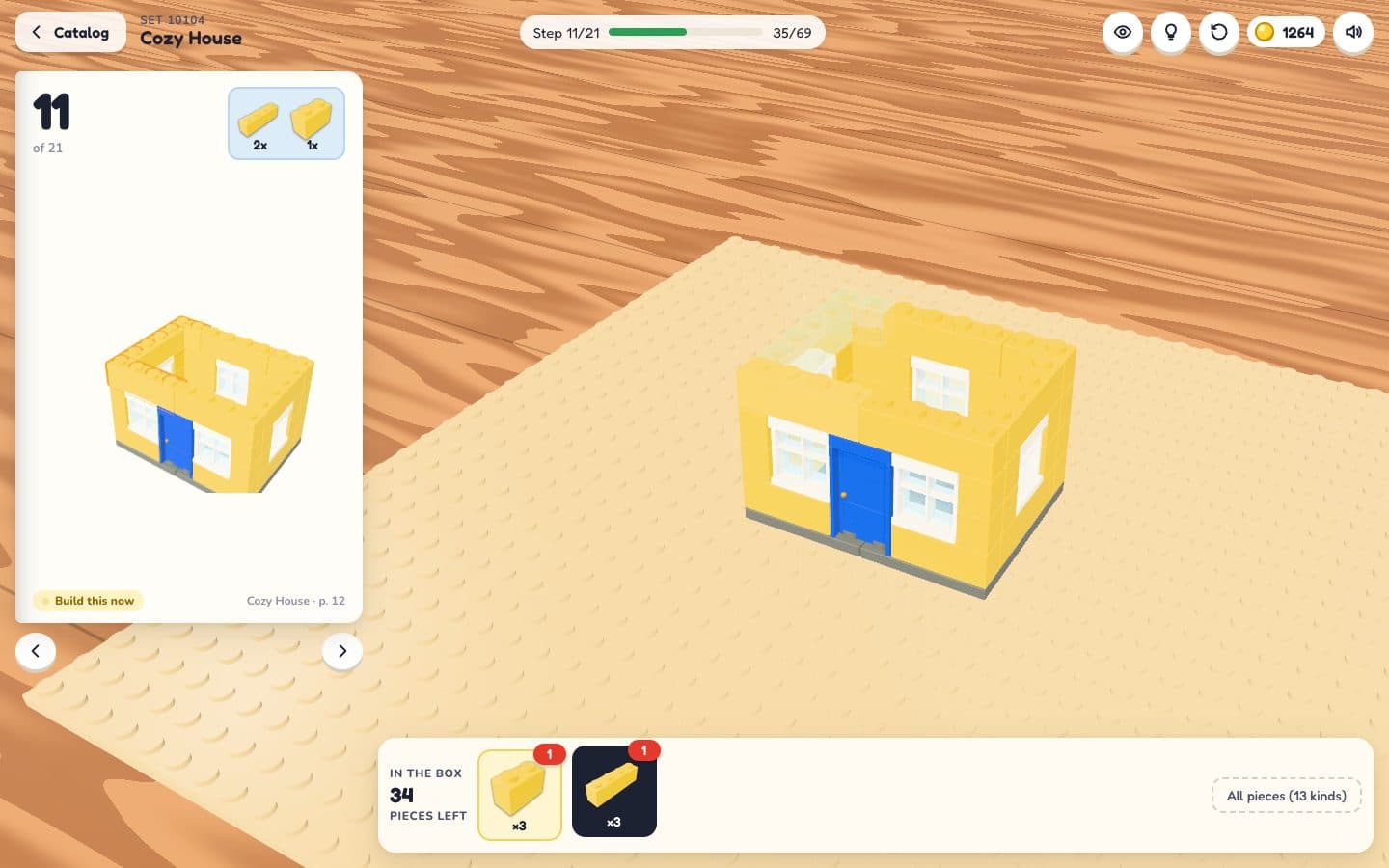 Brickyard: a half-built house on a baseplate, the instruction booklet open on the left and the parts tray below